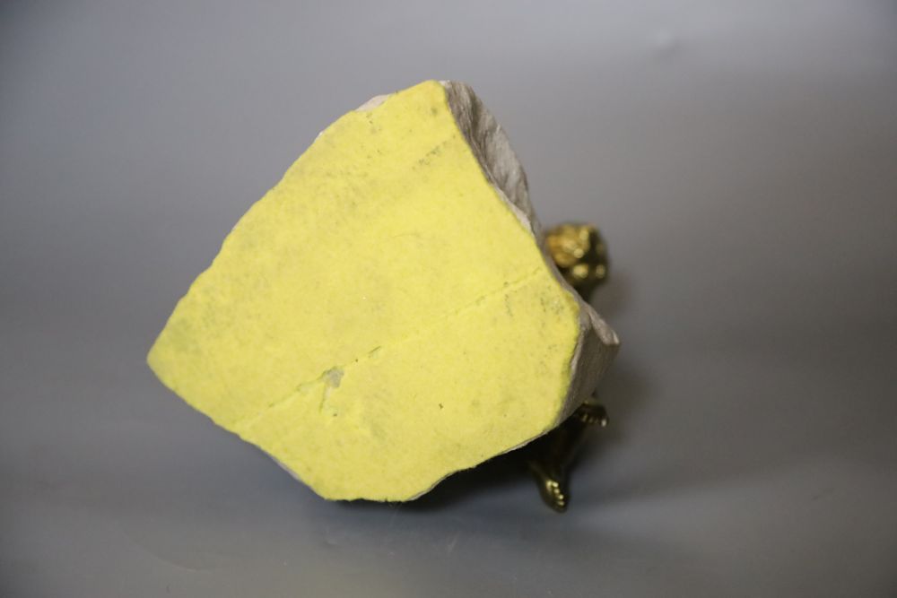 An ormolu seated tambourinist, on granite plinth, 19cm